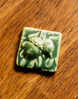 This 3x3 ceramic acorn tile is in the matte green Leaf glaze option.