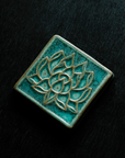 This tile features the crystalline, shimmering deep green Viridian glaze.