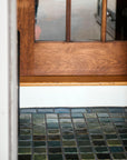 Detailed shot of 3x3 tiles in blue and green surrounded by 3x4 border tiles in grey and blue.