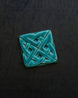 The 3 inch square Eternity Knot Tile includes the design of two oval shapes intertwined to create the Celtic Eternity knot.