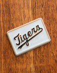Rectangular 4x6 tile with 'Tigers' branding on a wooden surface.