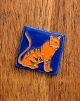Hand-painted 3x3 Tigers tile on a wooden surface.
