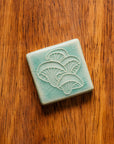 This tile features the glossy pale blue Celadon glaze.