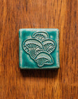 This tile features the matte turquoise Pewabic Blue glaze.