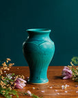 This vase features the matte turquoise Pewabic Blue glaze.