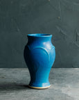 The Peacock glaze is a matte french blue color.