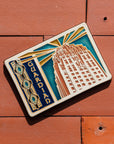 The Guardian Building Postcard tile depicts the building's iconic facade and
'Guardian' text on the terracotta roof tiles.