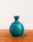 This Bud Vase features the matte turquoise Pewabic Blue glaze.