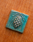 This tile features the crystalline, shimmering deep green Viridian glaze.