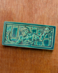 This tile features the matte turquoise Pewabic Blue glaze.