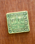 This tile features the matte organic green Leaf glaze.
