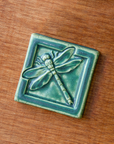 This Dragonfly Tile features the matte blueish-green Pewabic Green glaze.