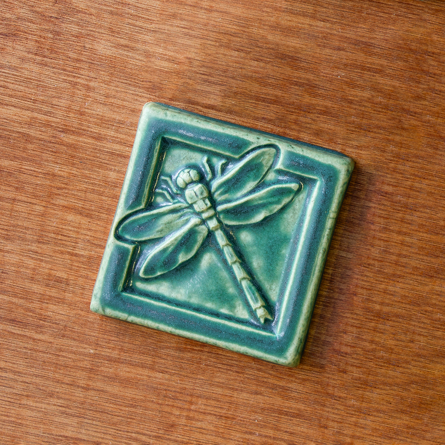 This Dragonfly Tile features the matte blueish-green Pewabic Green glaze.