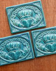 This tile features the matte turquoise Pewabic Blue glaze.