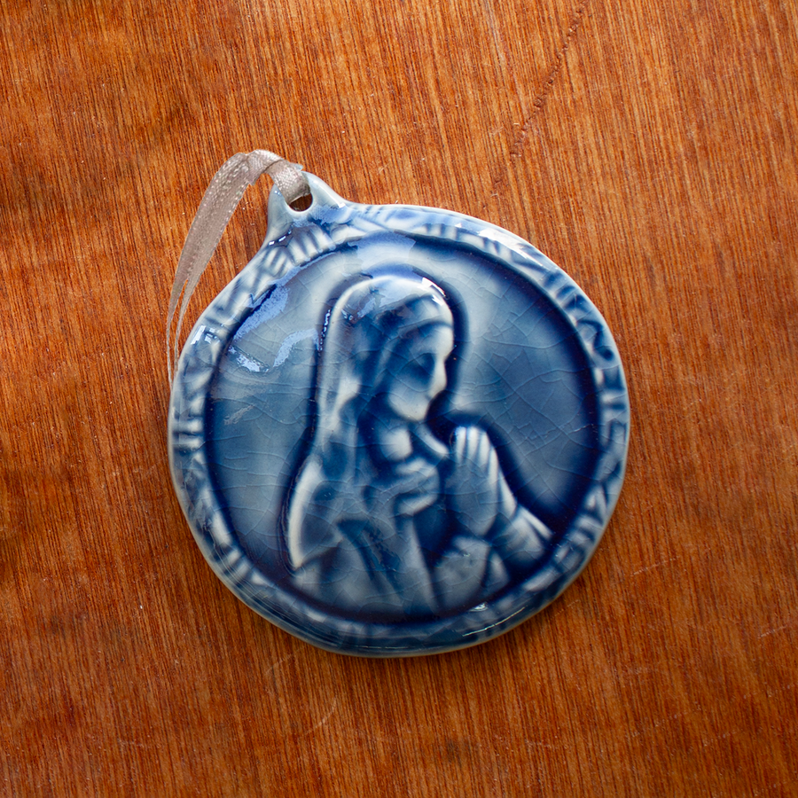 This ceramic Blessed Virgin Mary Ornament is glazed in a glossy deep blue Ocean glaze.