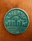 This Detroit Trivet Tile features the matte blueish-green Pewabic Green glaze.