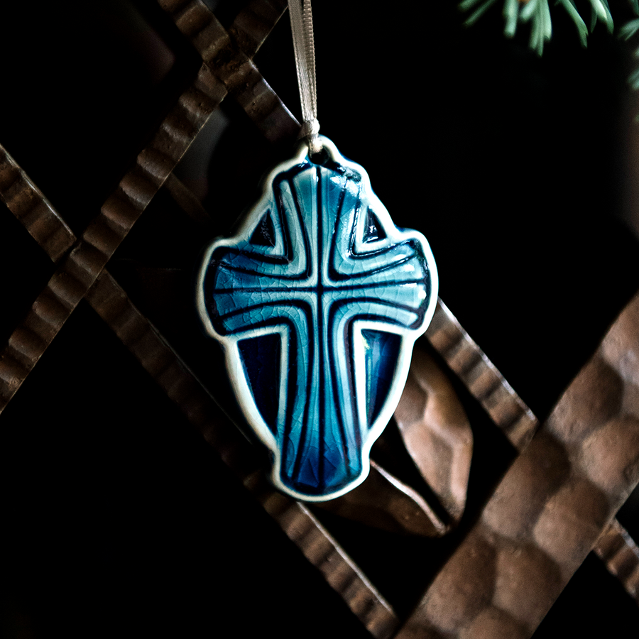 This Cross Ornament features the glossy deep blue Ocean glaze.