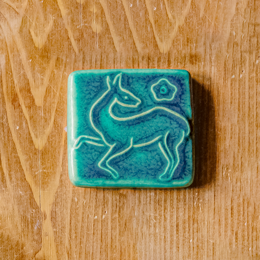This tile features the matte turquoise Pewabic Blue glaze.