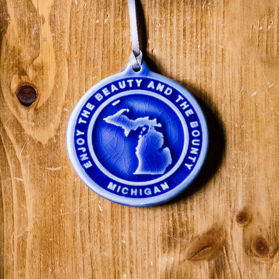 This Michigan Ornament features the glossy bright blue Lake Superior.