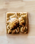 This 3x3 acorn tile is in the creamy light brown Wheat glaze option.