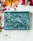 This Dogwood Tile features the matte turquoise Pewabic Blue glaze.