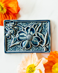 This Dogwood Tile features the glossy deep blue Ocean glaze.