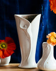 The ceramic Calla Lily vase features the matte white Birch glaze with natural speckles of iron dotting the surface of the glaze.
