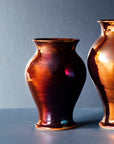 This copper vase has more pinks, reds and purples in its finish. This showcases the wide varieties in this glaze.