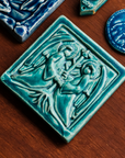 This Two angels tile features the matte turquoise Pewabic Blue glaze.