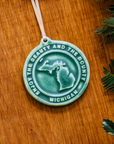 This Michigan Ornament features the matte blueish-green Pewabic Green glaze.