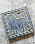 The left-facing Lion tile in the Dusk glaze sits on a black and white map of Detroit.