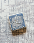 This Lion tile features the blue-gray semi-gloss Duck glaze. This glaze has natural crazing across its surface.
