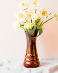 The Copper iridescent glaze is a shiny, smooth metallic glaze with many variations. Some pieces end up with a blue-gray flashing of color that covers a portion of the surface.