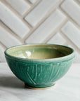 This bowls features the matte blueish-green Pewabic Green glaze.