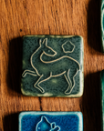 This tile features the matte dark mossy green Bayleaf glaze.