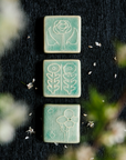 The Two Flowers Tile is displayed with the other two tiles in this series - the Rose Tile and the Cactus Flower Tile.