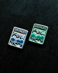 The Detroit Magnet is a rectangular tile featuring a tree lined road leading towards the Detroit skyline. The word Detroit is in bold letters across the top of the tile.