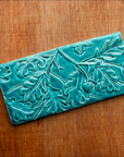This Oak Laves Tile features the turquoise Pewabic Blue glaze. 