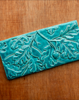 This Oak Laves Tile features the turquoise Pewabic Blue glaze.