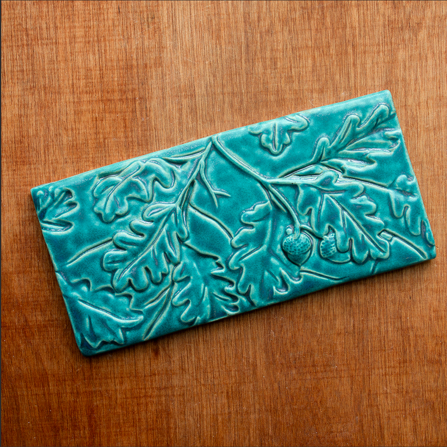 This Oak Laves Tile features the turquoise Pewabic Blue glaze. 