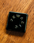 The tile features the glossy black Obsidian glaze.