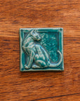 This cat tile is shown in a matte Pewabic green glaze.