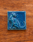 This cat tile is shown in a matte-blue Peacock glaze.
