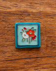 A Hand-Painted Bouquet Tile in our "Poppy Palette."