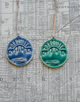 These Detroit Ornaments are featured in the matte powder blue Steel and matte green Pewabic Green glazes.