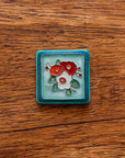 A Hand-Painted Three Flowers Tile in our "Poppy Palette."