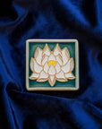 The Lotus tile features a line drawing of a blooming lotus flower, its pointed petals outstretching. It has a simple border around the design.