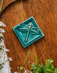 This Dragonfly Tile features the matte blueish-green Pewabic Green glaze.