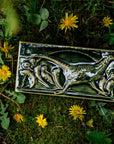 This hand-sculpted tile features a pheasant running through a field of dandelions. It is featured in a glossy green Kale glaze.