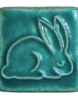 This ceramic Bunny Tile is featured in the matte turquoise Pewabic Blue glaze.